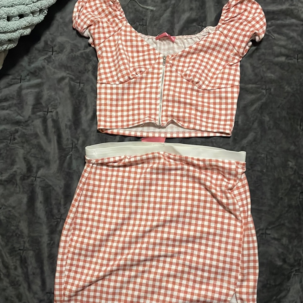 Pink mini skirt and crop top set.